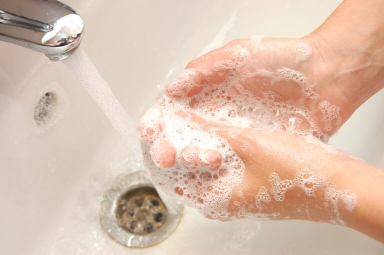 woman washing hand under running Beautiful picture